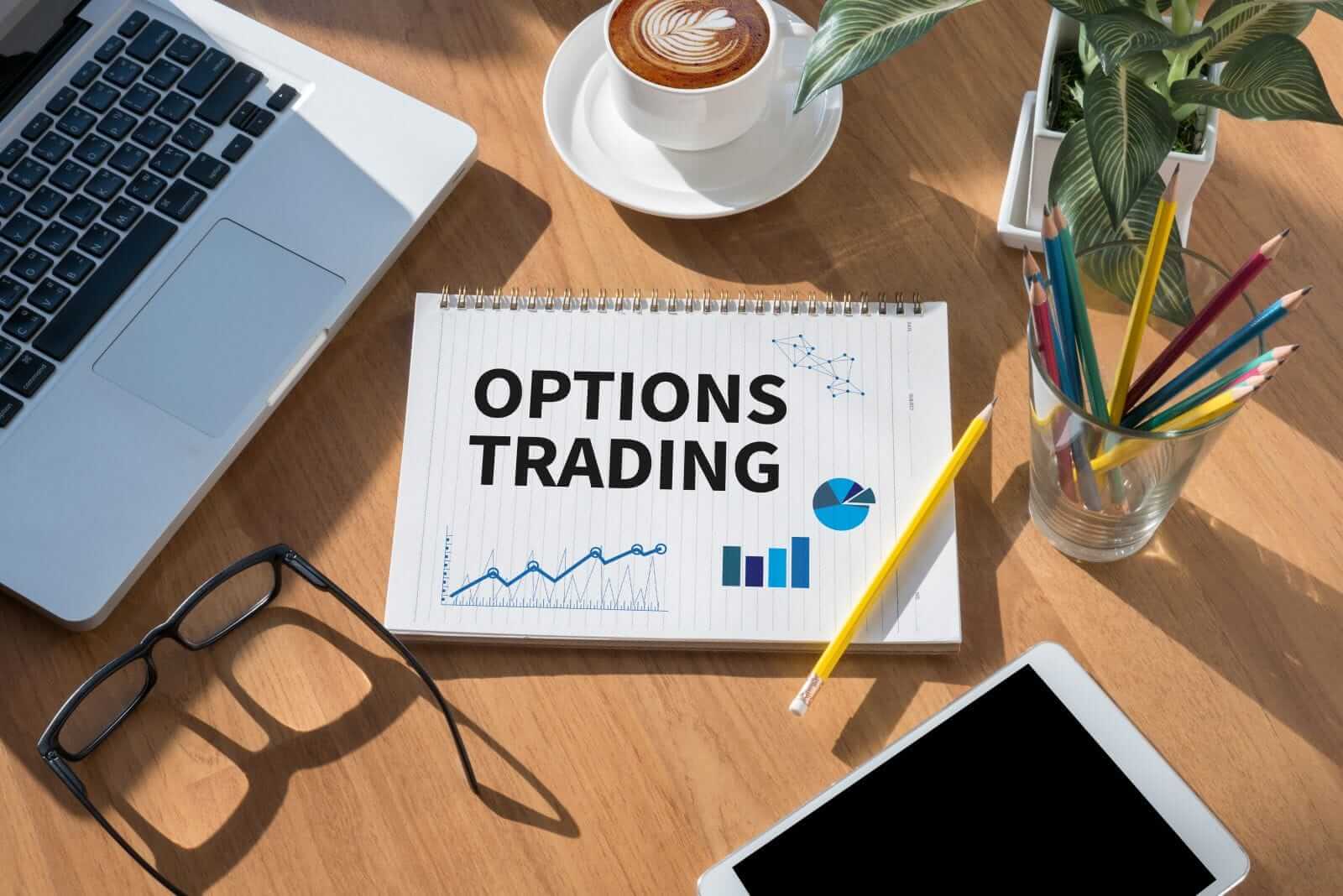 OPTIONS TRADING open book on table by One Photo via Shutterstock